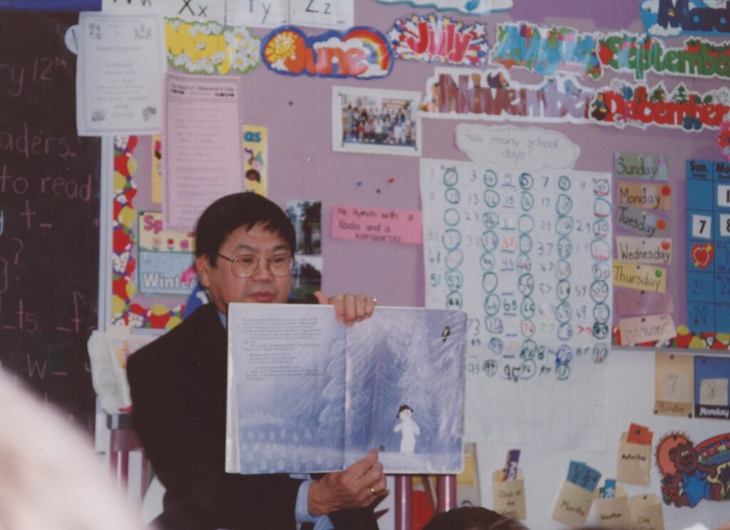 Principal Art Miki reading to a kindergarten class at Joseph Teres School (1989).